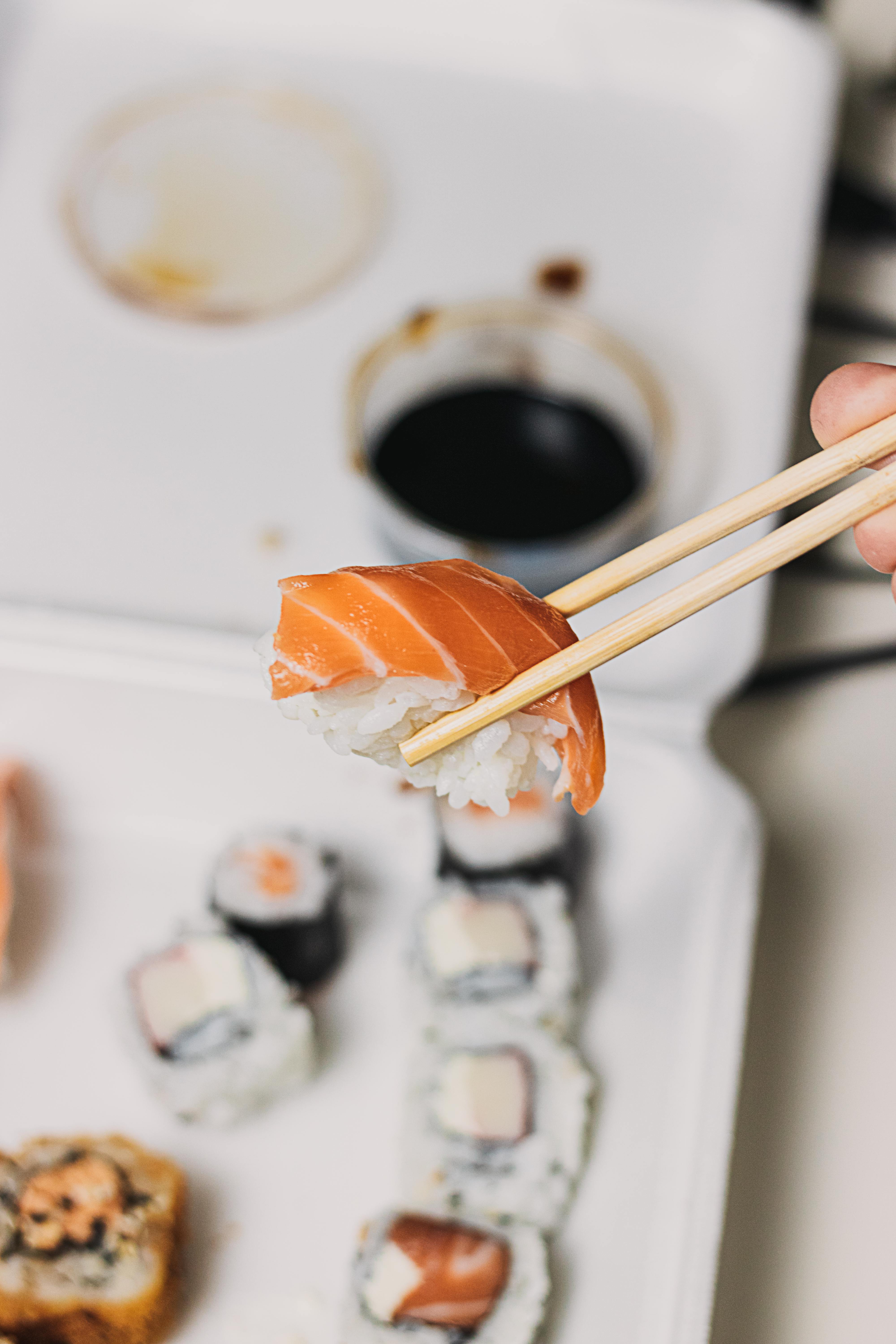 Takeaway sushi being held in one hand